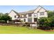 Stately two-story home with manicured lawn at 615 Lovinggood Trl, Woodstock, GA 30189