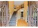 Grand foyer with wrought iron staircase at 615 Lovinggood Trl, Woodstock, GA 30189