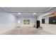 Garage offering neutral paint, concrete flooring, and lots of natural light at 615 Lovinggood Trl, Woodstock, GA 30189