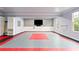 Garage boasting multi-colored flooring, neutral walls, and plenty of storage at 615 Lovinggood Trl, Woodstock, GA 30189