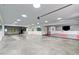 Spacious garage with concrete floors, ample lighting, and large mirrors at 615 Lovinggood Trl, Woodstock, GA 30189