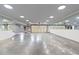 Spacious garage with concrete flooring, large mirrors, and an automatic door at 615 Lovinggood Trl, Woodstock, GA 30189