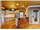 The kitchen features granite countertops, wooden cabinetry, stainless steel appliances, and a breakfast bar at 615 Lovinggood Trl, Woodstock, GA 30189