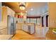 Spacious kitchen featuring wooden cabinets, stainless steel appliances, and granite countertops at 615 Lovinggood Trl, Woodstock, GA 30189