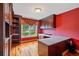 Home office with hardwood floors, custom shelving, and large window at 615 Lovinggood Trl, Woodstock, GA 30189