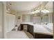Bathroom with double vanity, mirrors, and tile flooring at 816 Blackfoot Trl, Suwanee, GA 30024