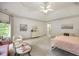 Large bedroom offers ample space for relaxing, with a sitting area and a makeup vanity at 816 Blackfoot Trl, Suwanee, GA 30024