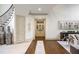 Hallway with decorative vases, hardwood floors, and stairs to second floor at 816 Blackfoot Trl, Suwanee, GA 30024