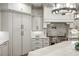Bright kitchen featuring stainless steel appliances, stone countertops, custom cabinets and a decorative hood at 816 Blackfoot Trl, Suwanee, GA 30024