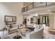 Bright open living space with high ceilings, dark wood flooring, and a second-floor balcony at 816 Blackfoot Trl, Suwanee, GA 30024
