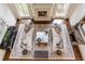Overhead view of the living room with a fireplace, sofas, and hardwood floors at 816 Blackfoot Trl, Suwanee, GA 30024
