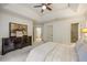Carpeted main bedroom with a horse print above a dark dresser at 816 Blackfoot Trl, Suwanee, GA 30024
