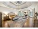 Tranquil main bedroom features tray ceilings, a fireplace, and multiple windows at 816 Blackfoot Trl, Suwanee, GA 30024