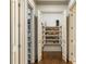 A shoe closet displaying a large assortment of footwear on shelves at 816 Blackfoot Trl, Suwanee, GA 30024