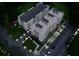 Aerial view showcases modern townhomes, manicured landscaping, street lights, and convenient parking at 1237 Memorial Se Dr # 303, Atlanta, GA 30316