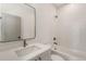 Modern bathroom with white subway tiles, marble floors, and a sleek vanity with a rectangular mirror at 1237 Memorial Se Dr # 303, Atlanta, GA 30316