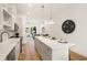 Open concept kitchen with large island, stainless steel appliances, and hardwood floors at 1237 Memorial Se Dr # 303, Atlanta, GA 30316