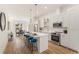 Modern kitchen with white cabinets, stainless steel appliances, a center island with seating, and hardwood floors at 1237 Memorial Se Dr # 303, Atlanta, GA 30316