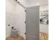 Clean laundry room with wire shelving, gray door, and space for appliances at 1237 Memorial Se Dr # 303, Atlanta, GA 30316