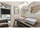 Modern bathroom featuring dual vessel sinks, modern fixtures, and access to the bedroom at 1300 Dekalb Ne Ave # 711, Atlanta, GA 30307