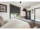 Bright bedroom features a ceiling fan, modern desk and a large window at 1300 Dekalb Ne Ave # 711, Atlanta, GA 30307