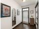 Hallway with dark hardwood floors, white walls and modern design elements at 1300 Dekalb Ne Ave # 711, Atlanta, GA 30307
