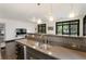 Modern kitchen featuring stainless steel appliances, breakfast bar with gray counters, and lots of windows at 1300 Dekalb Ne Ave # 711, Atlanta, GA 30307
