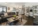 Open living space with leather sofa, stainless steel appliances, and hardwood floors at 1300 Dekalb Ne Ave # 711, Atlanta, GA 30307