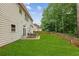 Spacious backyard with a well-maintained lawn, ideal for outdoor activities and relaxation at 3395 The Commons Dr, Cumming, GA 30041