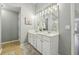 Bathroom with double sinks and vanity and a glass shower at 3395 The Commons Dr, Cumming, GA 30041