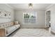 A living room with a window view and a large area rug at 3395 The Commons Dr, Cumming, GA 30041