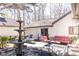 Backyard features a serene fountain and elegant outdoor seating, enhancing the property's charm and appeal at 4210 Gatewood Ln, Peachtree Corners, GA 30097