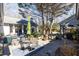 Inviting backyard patio features an outdoor dining set, lush greenery, and a barbecue area for perfect outdoor living at 4210 Gatewood Ln, Peachtree Corners, GA 30097