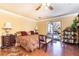 Comfortable bedroom features hardwood floors, a ceiling fan, and access to a patio at 4210 Gatewood Ln, Peachtree Corners, GA 30097