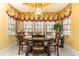 Cozy breakfast nook filled with natural light, features traditional furnishings, and window treatments at 4210 Gatewood Ln, Peachtree Corners, GA 30097