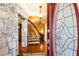 Grand foyer featuring hardwood floors, stone accents, and a staircase leading to the upper level at 4210 Gatewood Ln, Peachtree Corners, GA 30097