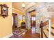Spacious entryway with hardwood floors, stone accents, and staircase at 4210 Gatewood Ln, Peachtree Corners, GA 30097
