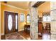 Elegant foyer with hardwood flooring, detailed trim, and a view into the adjacent dining area at 4210 Gatewood Ln, Peachtree Corners, GA 30097
