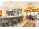 Large kitchen boasts an island with seating, stainless steel appliances, and an adjacent dining area at 4210 Gatewood Ln, Peachtree Corners, GA 30097
