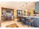 Gourmet kitchen showcasing custom cabinets, wine storage, stainless appliances, and island seating at 4210 Gatewood Ln, Peachtree Corners, GA 30097