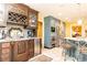 This kitchen boasts custom cabinets, modern appliances, and an island with seating at 4210 Gatewood Ln, Peachtree Corners, GA 30097