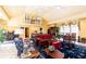 Spacious living room with high ceilings, stone fireplace, tile flooring, and multiple windows at 4210 Gatewood Ln, Peachtree Corners, GA 30097