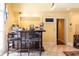 Living room showcases a wet bar with seating and tile flooring at 4210 Gatewood Ln, Peachtree Corners, GA 30097