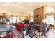 Spacious living room with high ceilings, stone fireplace, tile flooring, and multiple windows at 4210 Gatewood Ln, Peachtree Corners, GA 30097