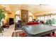 Spacious living room with high ceilings, stone fireplace, tile flooring, and multiple windows at 4210 Gatewood Ln, Peachtree Corners, GA 30097