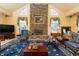 Living room showcases a stone fireplace, neutral paint, large windows and tile flooring at 4210 Gatewood Ln, Peachtree Corners, GA 30097