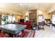 Spacious living room with high ceilings, stone fireplace, tile flooring, and multiple windows at 4210 Gatewood Ln, Peachtree Corners, GA 30097