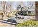 Charming water fountain in the front lawn of this beautiful Tudor-style home at 4210 Gatewood Ln, Peachtree Corners, GA 30097