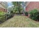 Backyard features a level, fenced yard with new grass; perfect for outdoor activities and gatherings at 4733 Eidson Road, Dunwoody, GA 30360
