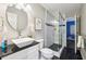 The bathroom features modern finishes, a glass-enclosed shower, a modern vanity and decor at 4733 Eidson Road, Dunwoody, GA 30360